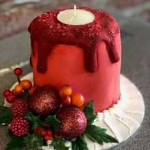 A bespoke cake crafted to look like a red melting candle.