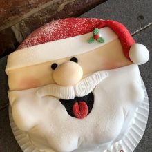 A bespoke cake made to look like Santa's face.